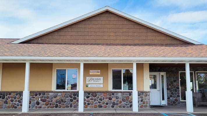 Exterior view of BeeHive Homes facility with signage