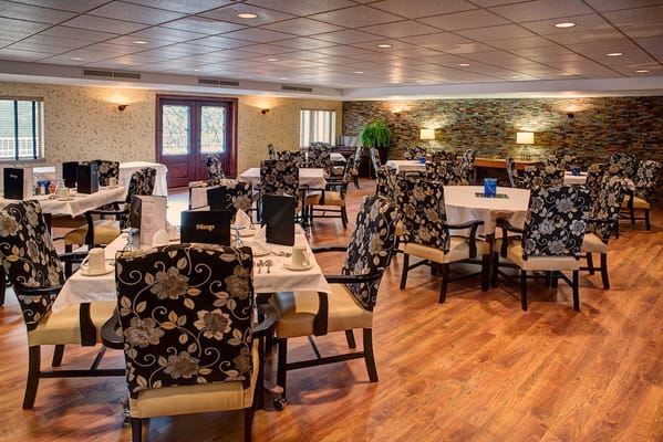 Dining room with elegant floral chairs and tables