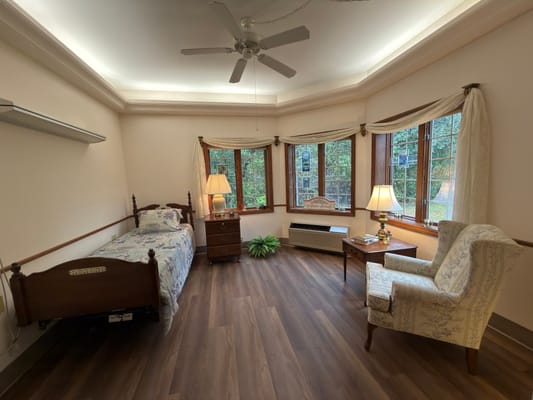 Cozy resident room with natural light and furnishings