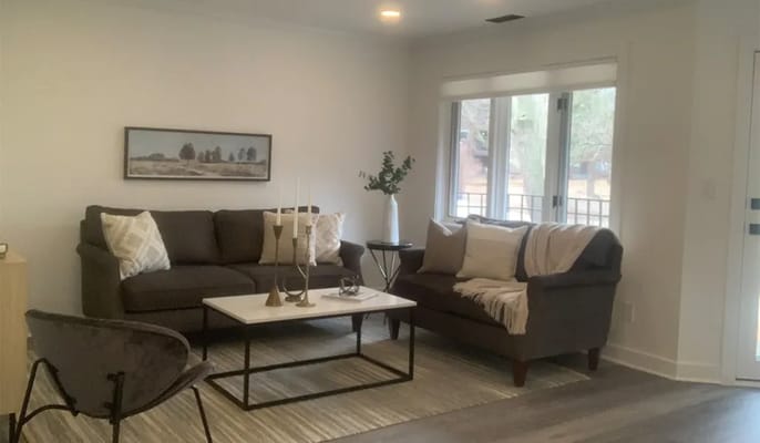 Cozy interior lounge area with seating and natural light