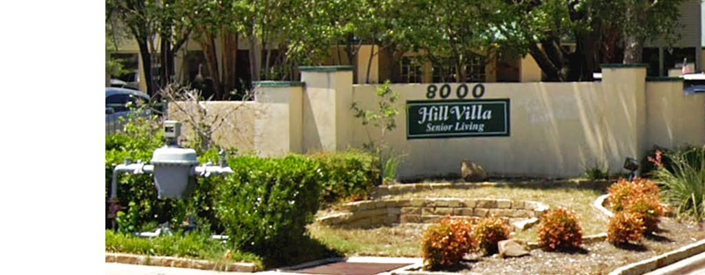 Exterior view of Hill Villa Senior Living entrance sign