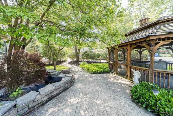 Pathway through a landscaped outdoor space with a gazebo
