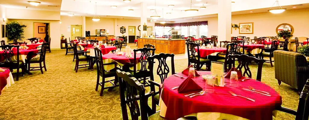 Interior dining room with tables set for meals