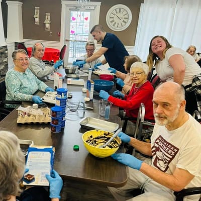 Residents participating in a cooking activity