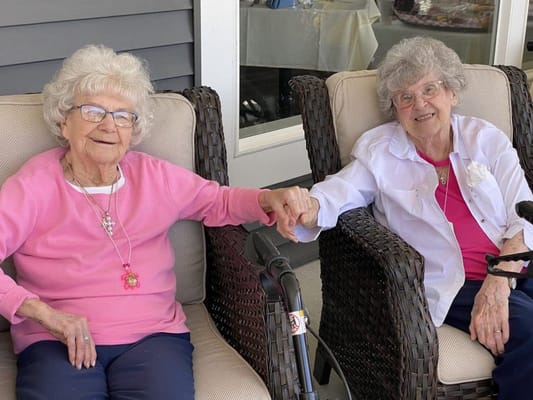 Two residents enjoying time together outdoors