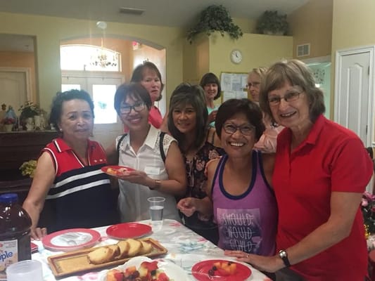 Residents and staff enjoying a meal together