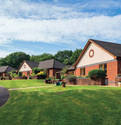 Exterior view of cottages in a landscaped setting