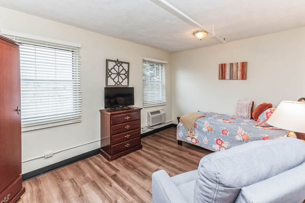 Cozy resident room with furniture and decor