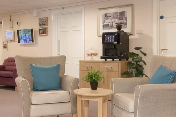 Common area with seating and a coffee machine