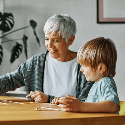 Resident and child engaging in a creative activity