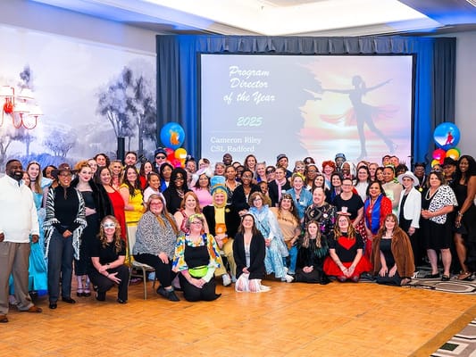 Staff and residents celebrating at an award event