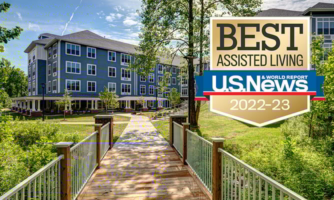 Exterior view of Evergreen Village at Bloomington with award logo