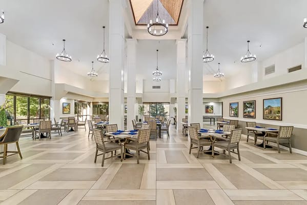 Bright dining room with tables and chairs