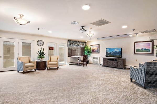 Bright common area with seating and a television