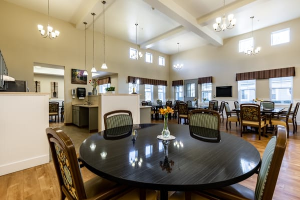 Bright dining area with tables and chairs