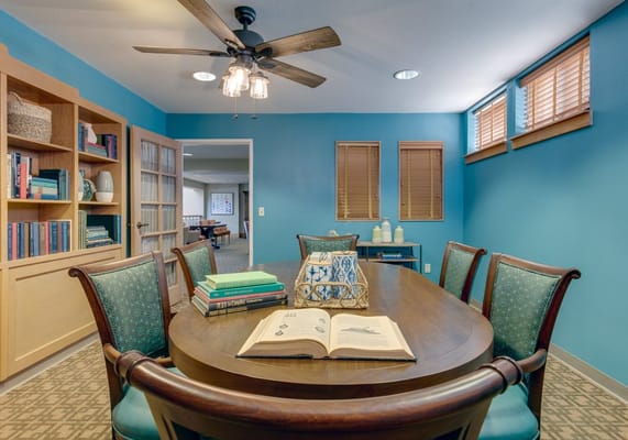 Interior common area with a reading table and seating