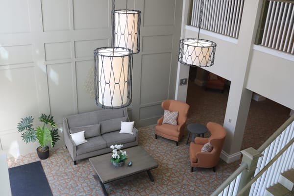 Bright common area with seating and plants