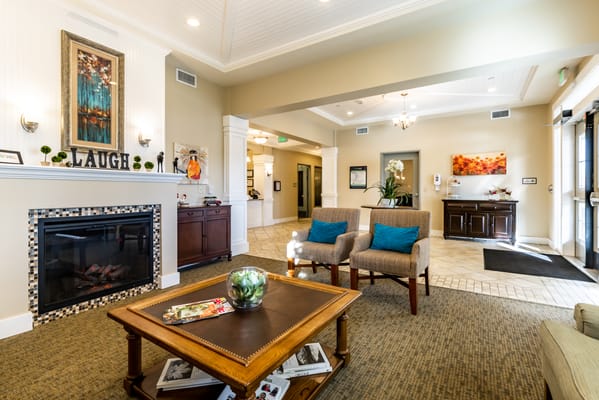 Bright and welcoming common area with a fireplace