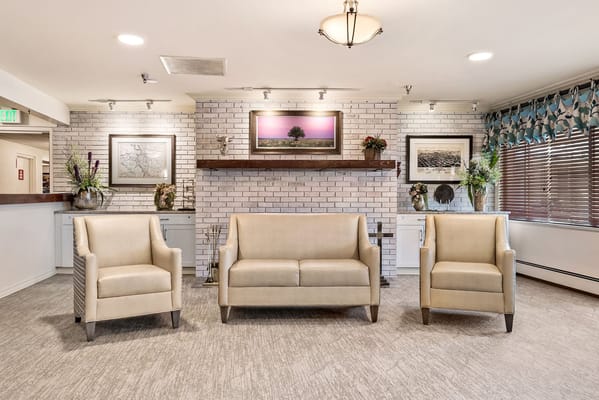 Bright common area with seating and artwork