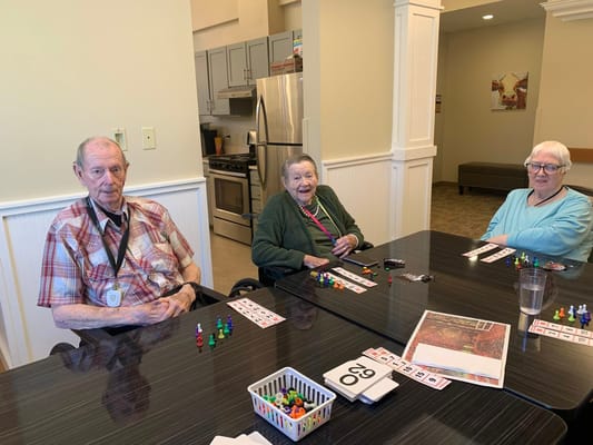 Residents playing a game in a common area
