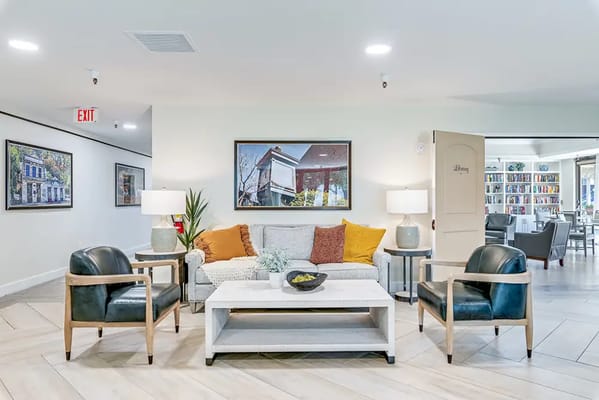 Common area with seating and bookshelves in the background