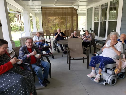 Residents enjoying ice cream on an outdoor patio