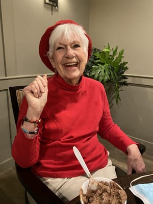 Senior resident enjoying ice cream in a common area