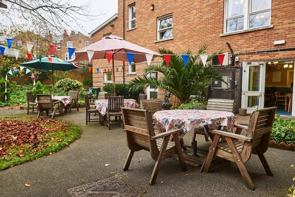 Outdoor dining area with tables and umbrellas