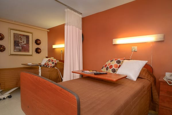 Cozy resident room with beds and decor