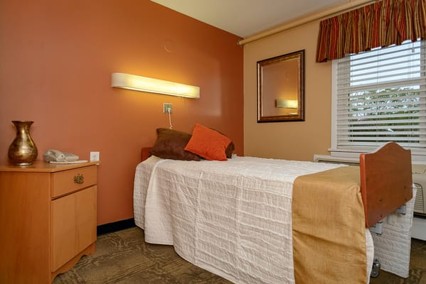 Cozy private room with a bed and decor