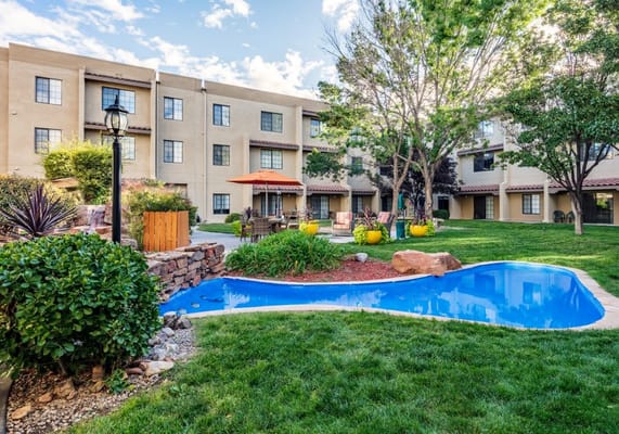 Outdoor space with pool and garden seating area