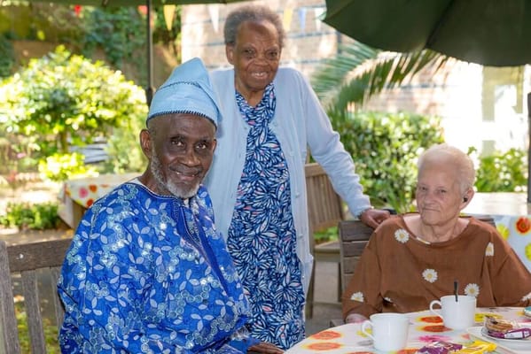 Residents enjoying a sunny day in the garden