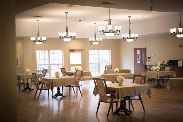 Dining area with tables and floral arrangements