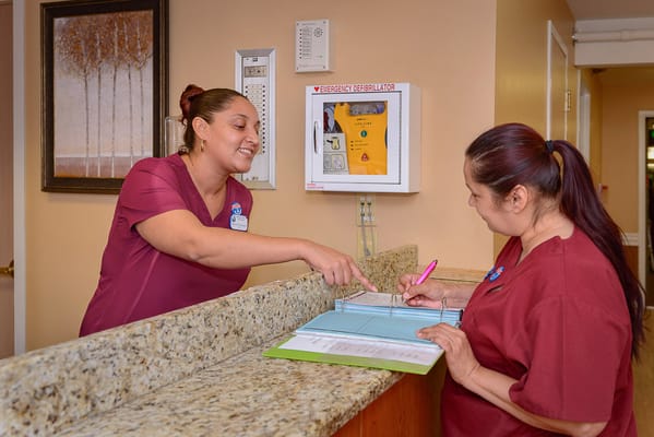 Staff assisting at reception desk