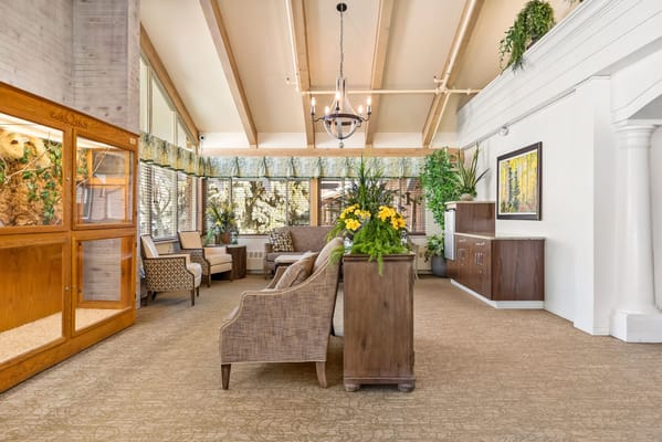 Cozy common area with comfortable seating and plants