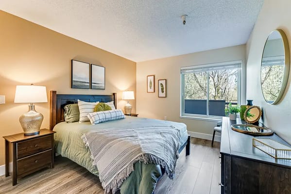 Well-furnished private bedroom in a senior living facility