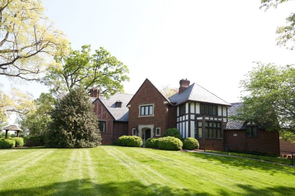 Exterior view of the facility with landscaped lawn
