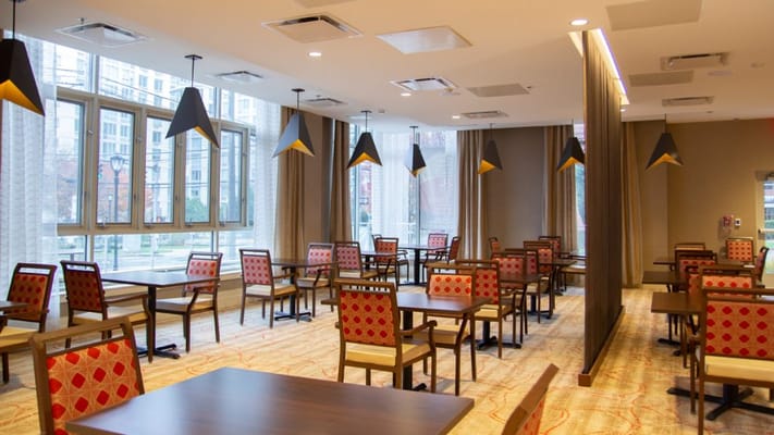 Bright dining area with tables and chairs