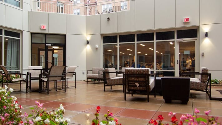 Outdoor seating area with flowers and seating