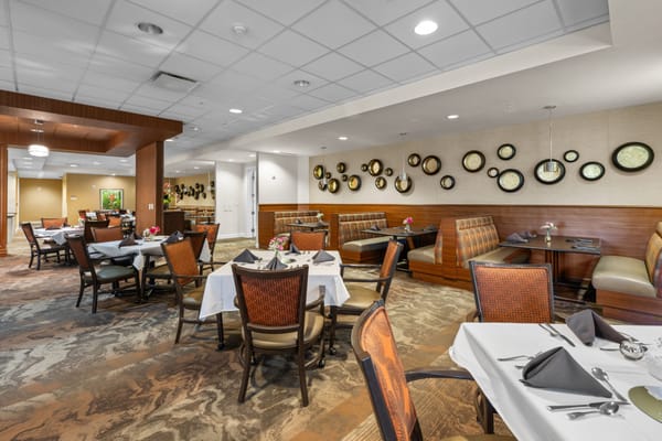 Dining area with neatly set tables and decor