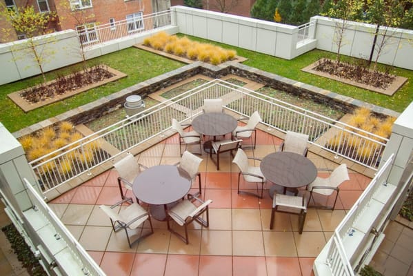 Outdoor seating area with tables and chairs