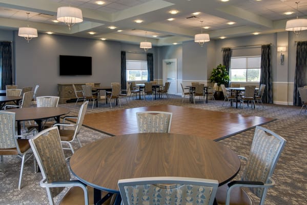 Interior view of a common area with tables and chairs
