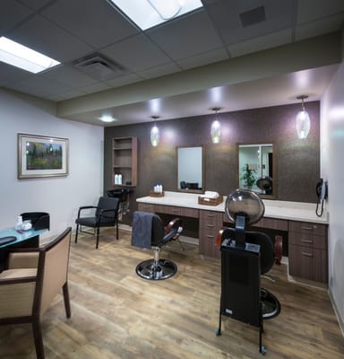 Interior view of a beauty salon with styling stations