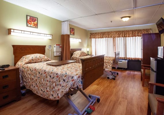 Cozy resident room with two beds and natural light