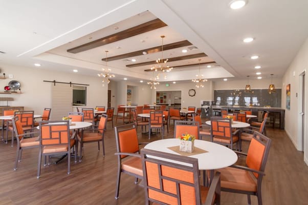 Bright dining area with modern decor and tables