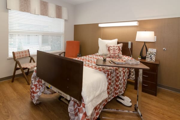 Cozy interior room with a bed and chair