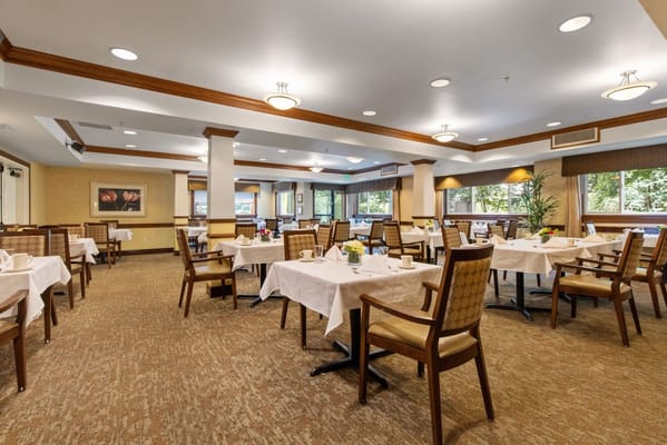 Bright dining room setup with tables and chairs