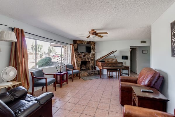 Cozy common area with seating and a piano