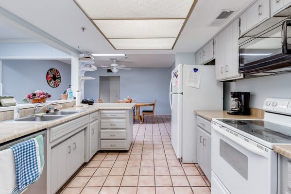 Bright kitchen space with appliances and dining area