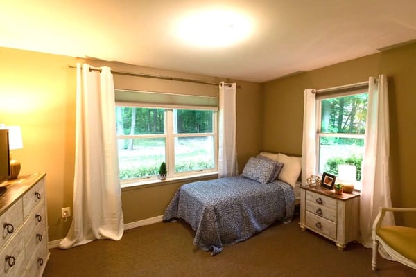 Cozy private room with bed and window view